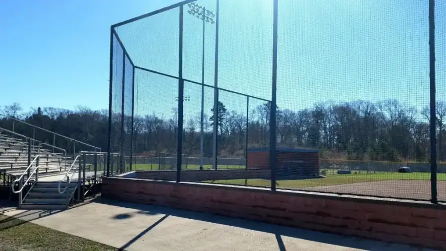 Large chain link baseball backstop structure built by Wilson Fence
